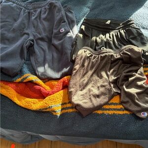 Trio of men’s small champion and Nike shorts and sweatpants
